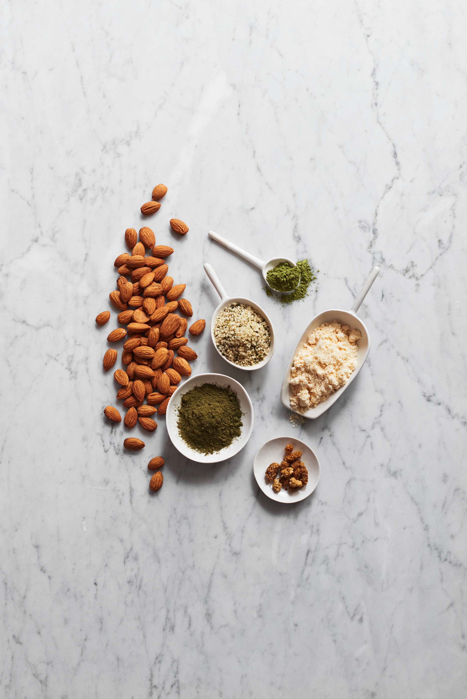 Green Ntidote ingredients photographed on white marble by Food Photographer Adrian Mueller New York