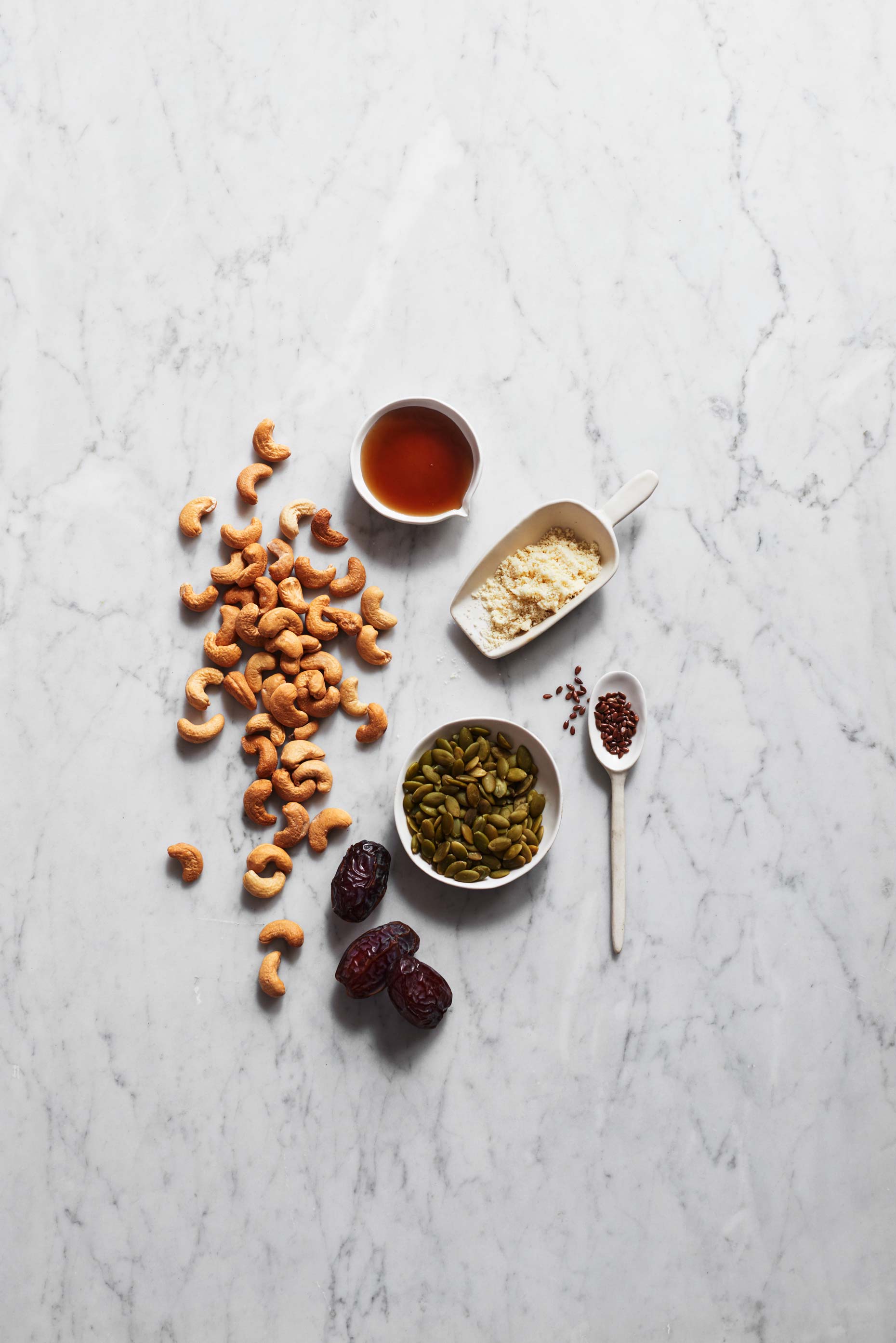 Yellow Ntidote ingredients on white marble photographed by Food Photographer Adrian Mueller New York