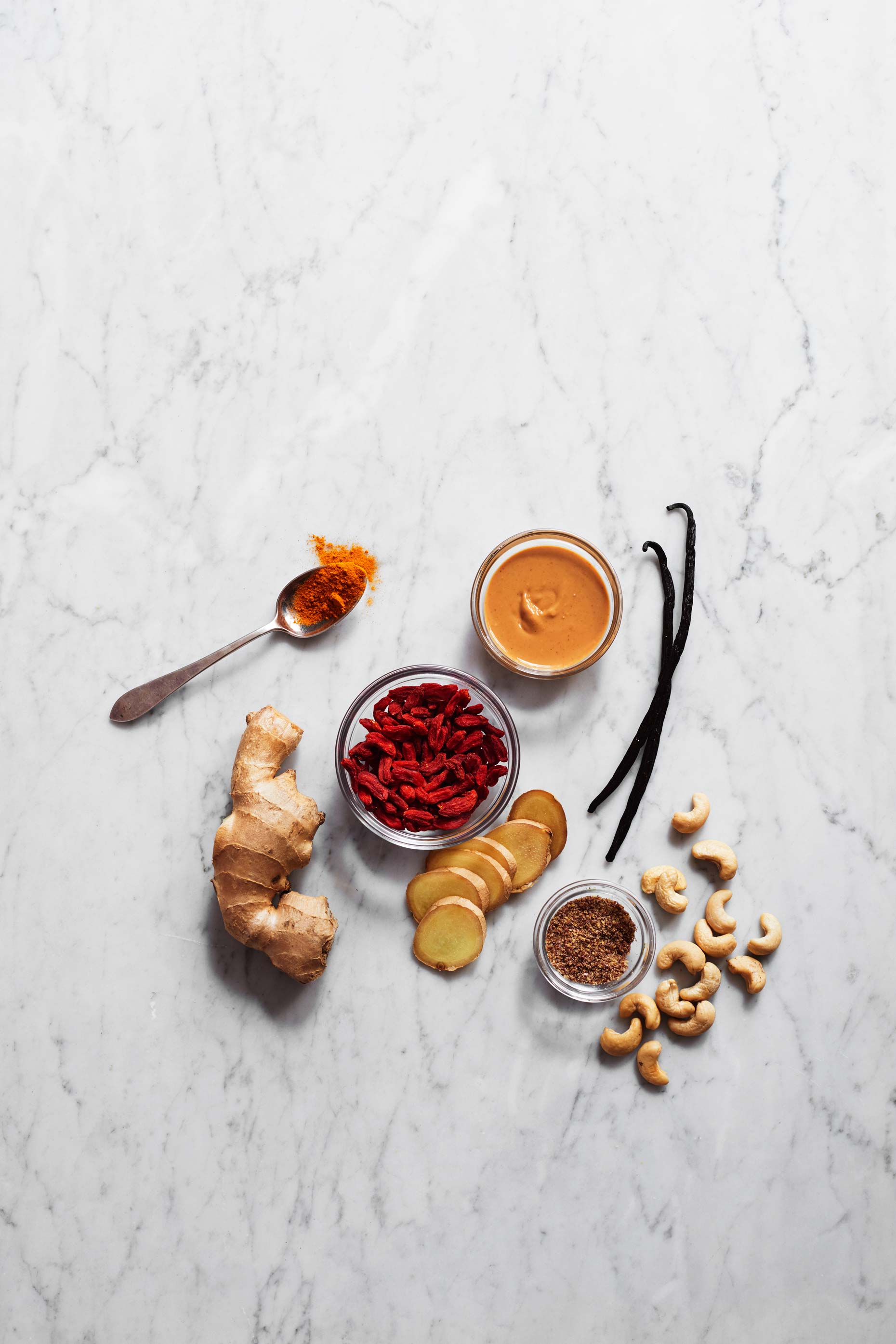 Red Ntidote ingredients on white marble photographed by Food Photographer Adrian Mueller New York