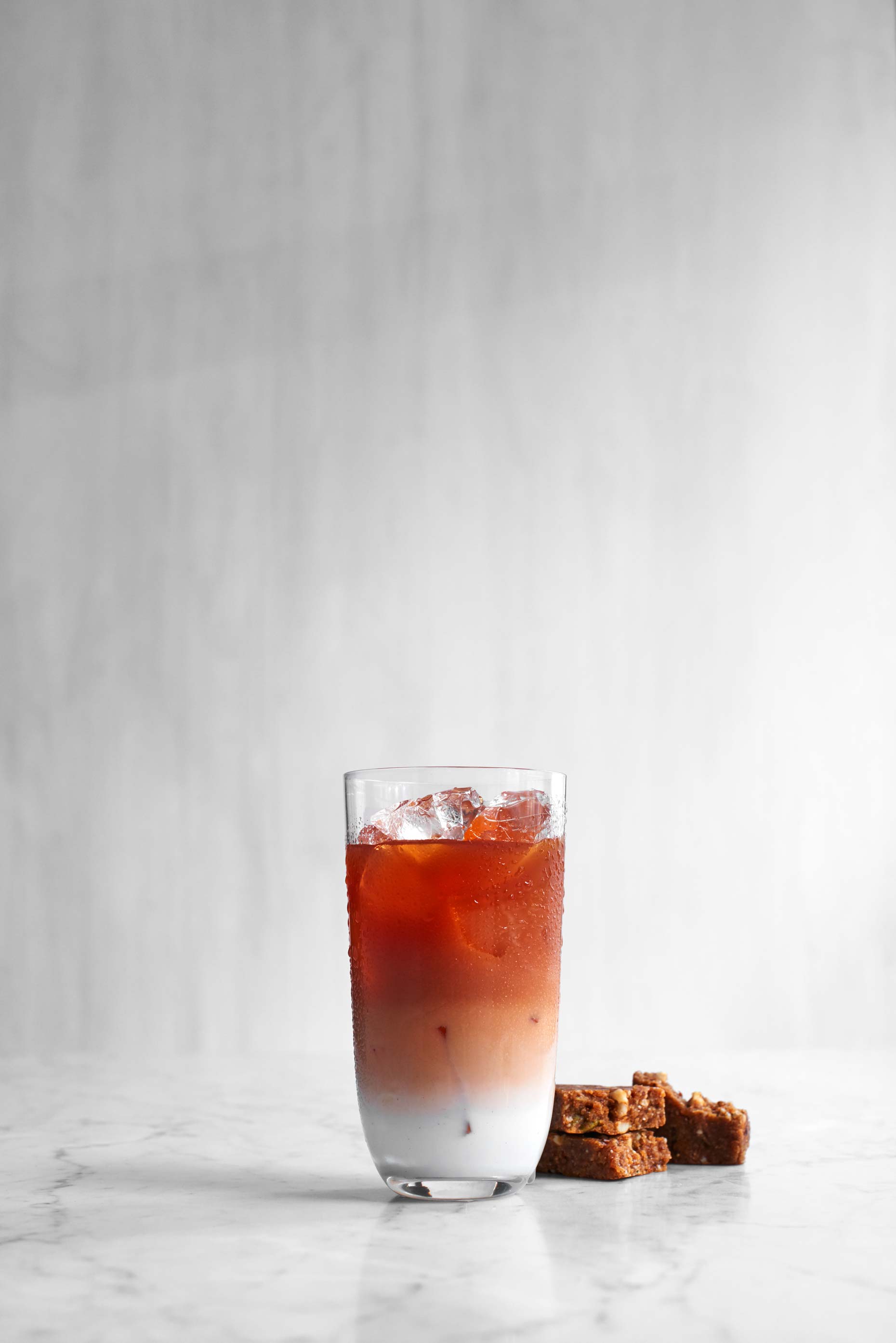 Red strawberry and raspberry smoothie photographed by Food Photographer Adrian Mueller New York