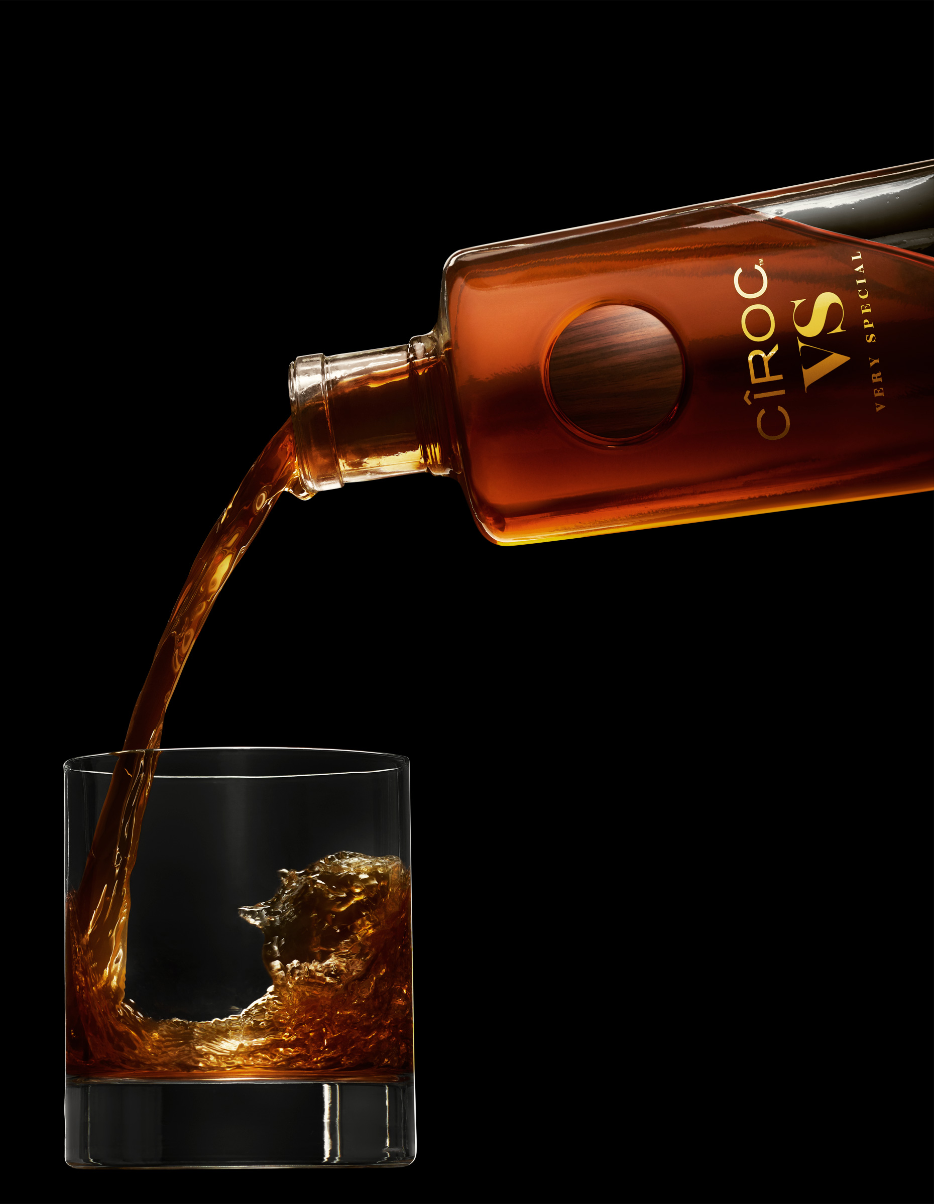 Ciroc VS bottle pouring brandy into a glass, photographed by Food & Beverage Photographer Adrian Mueller New York